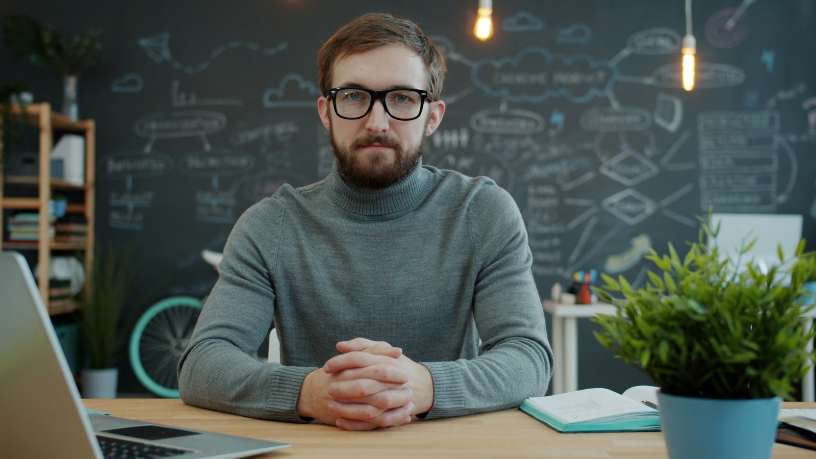 Small business owner setting up bookkeeping software at an office desk