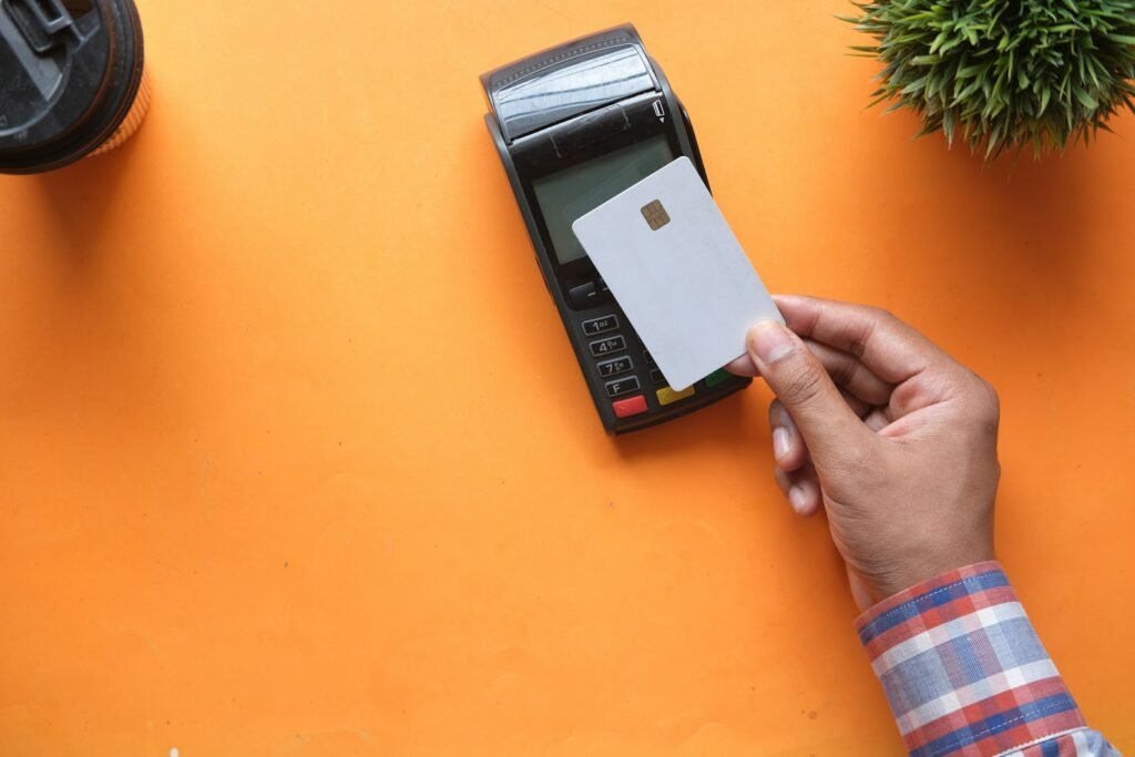 Credit card payment terminal representing processing fees for small business software costs