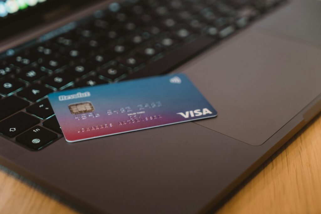 Debit card on a laptop keyboard for an online or manually entered payment