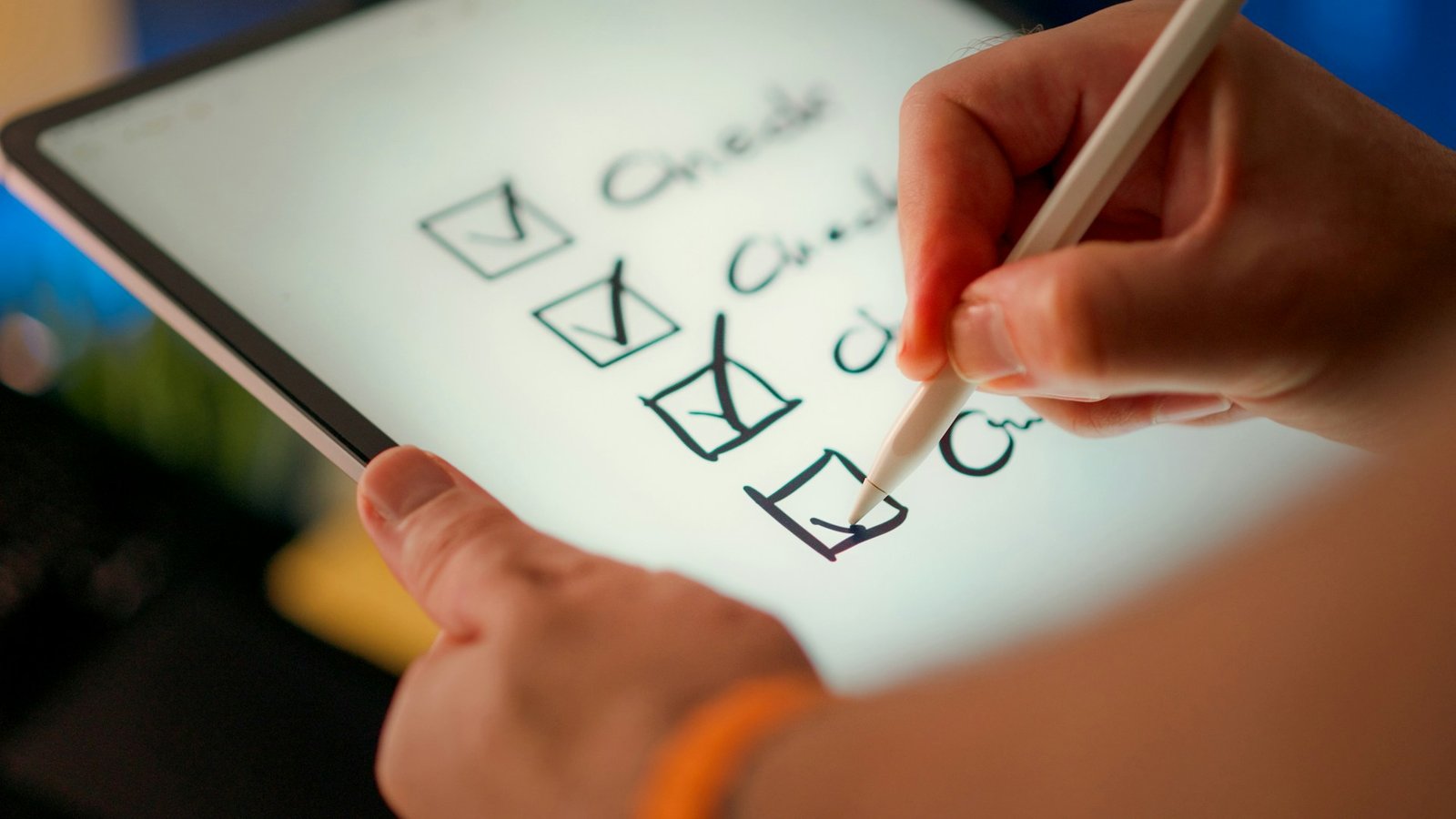 Hand checking off items on a checklist