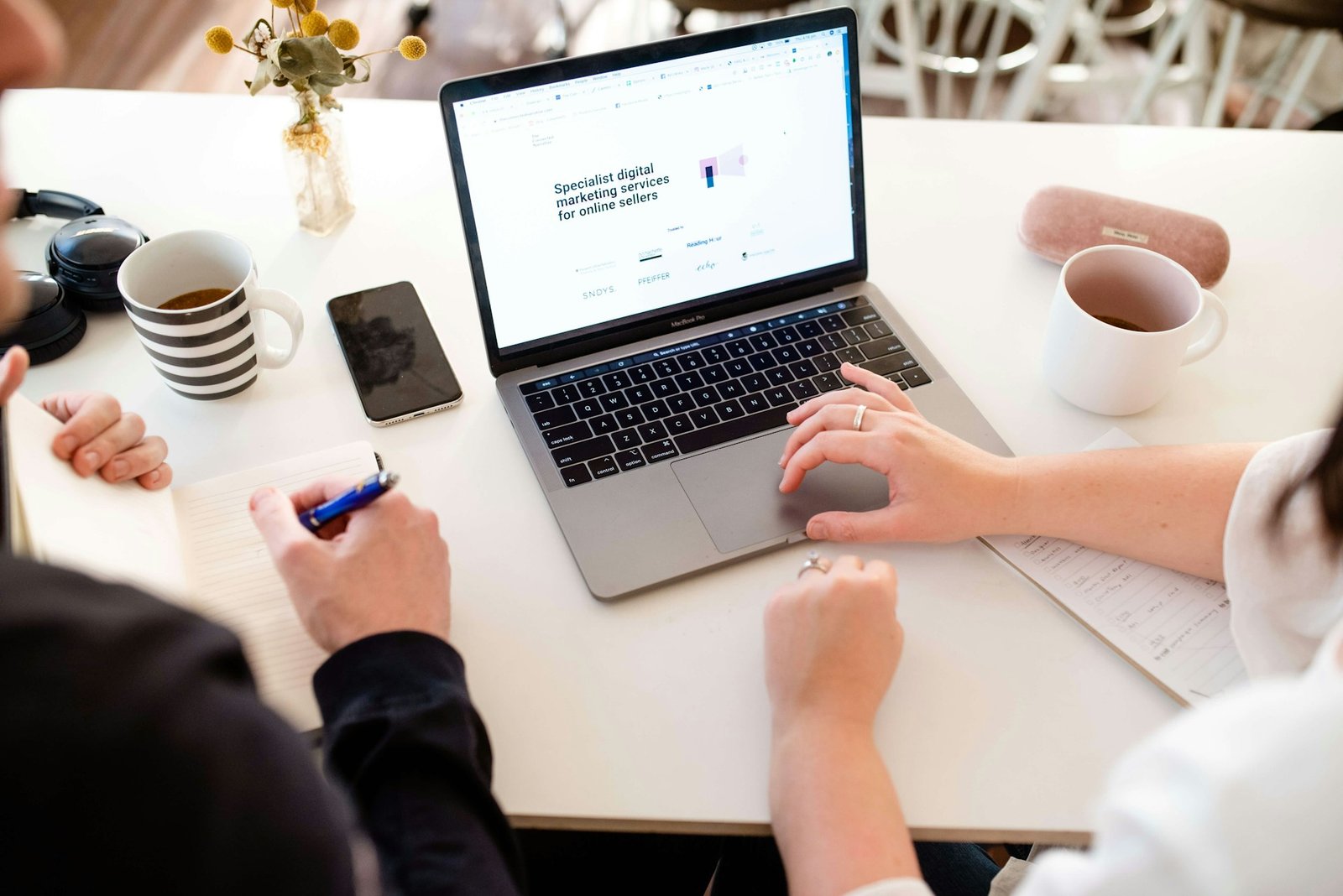 Person reviewing transactions on a laptop at a desk