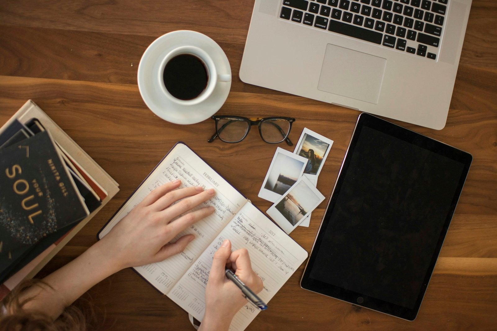 Person writing in a notebook while planning