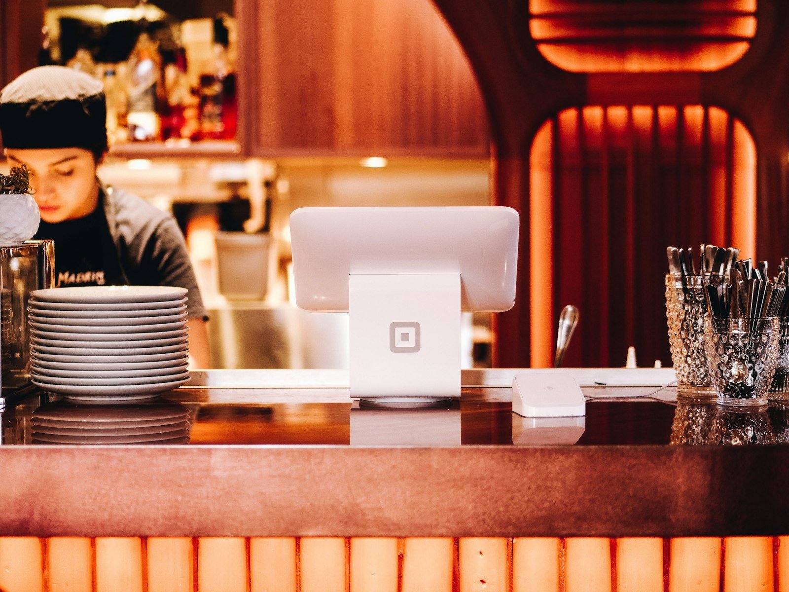 Restaurant owner standing near the counter