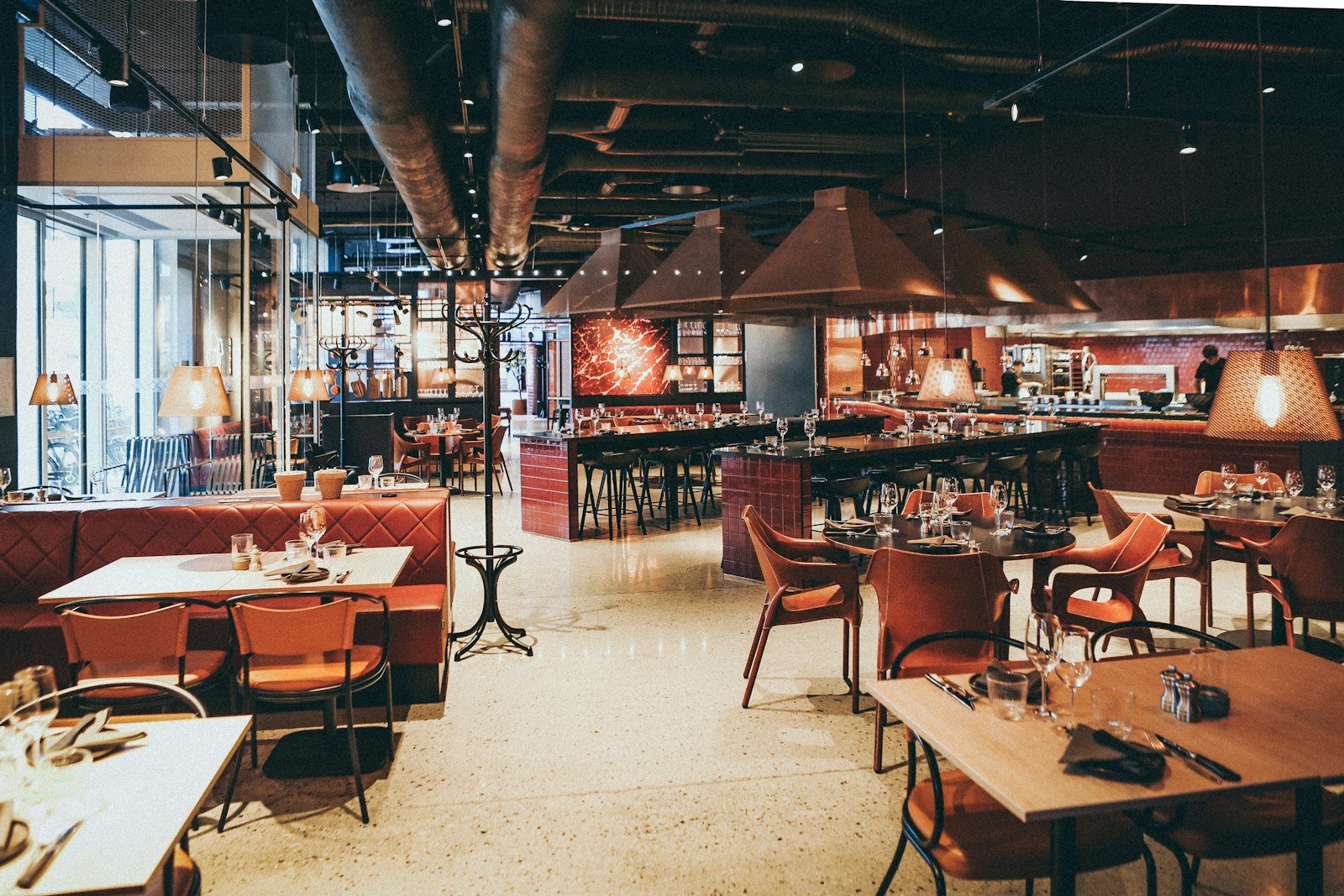 Restaurant interior with red leather booths, a setting for the best accounting software for restaurants