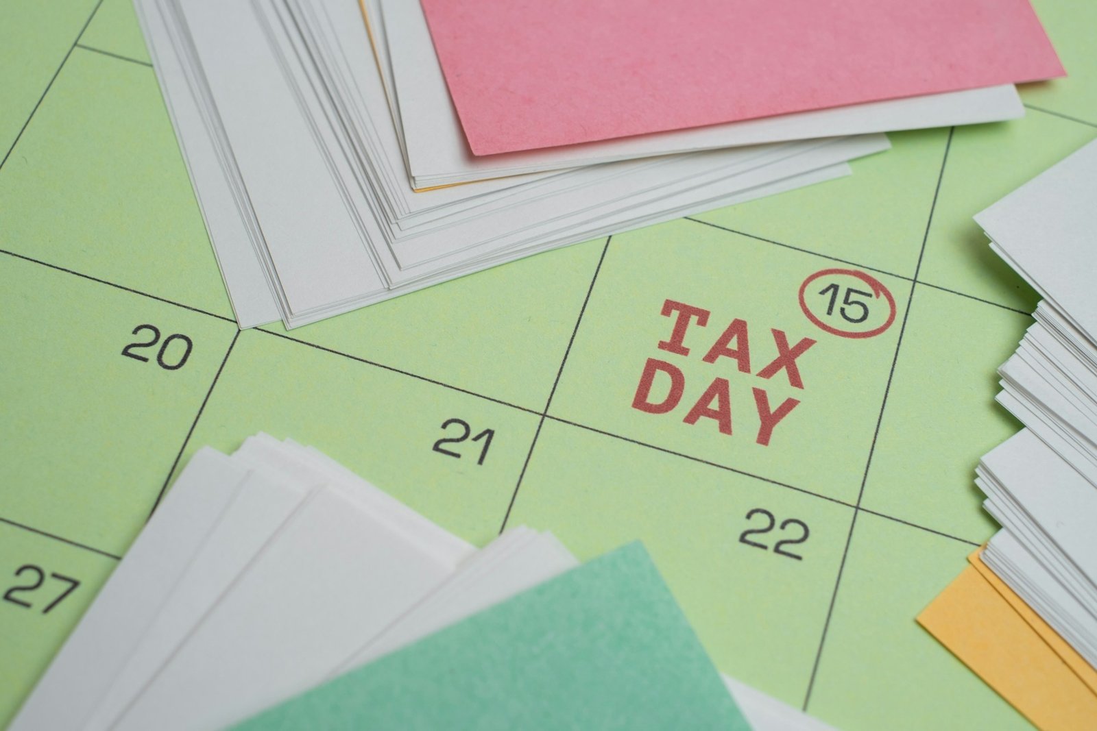 Tax filing day marked on a calendar with papers