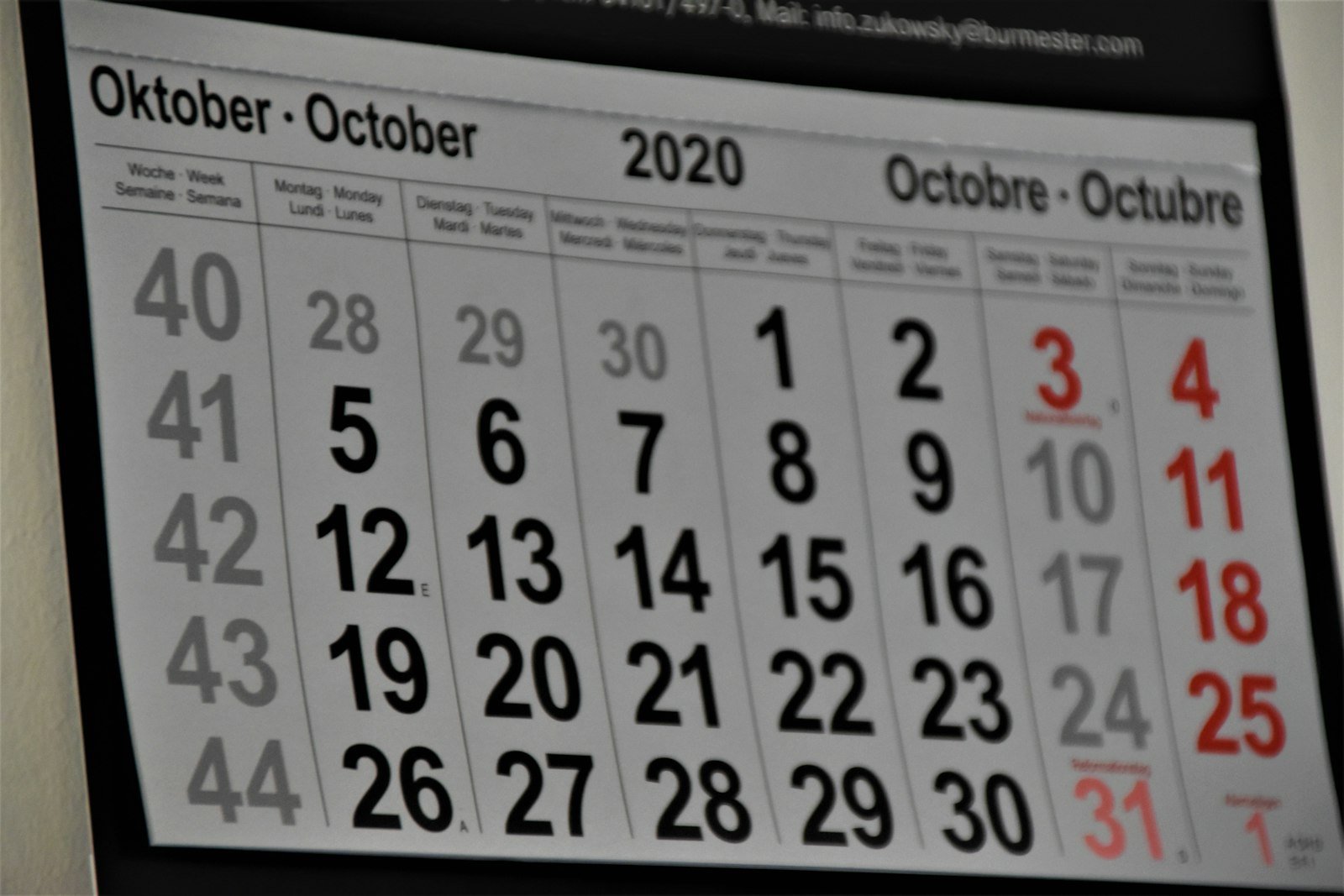 Black and white calendar on a wall marking the year end close