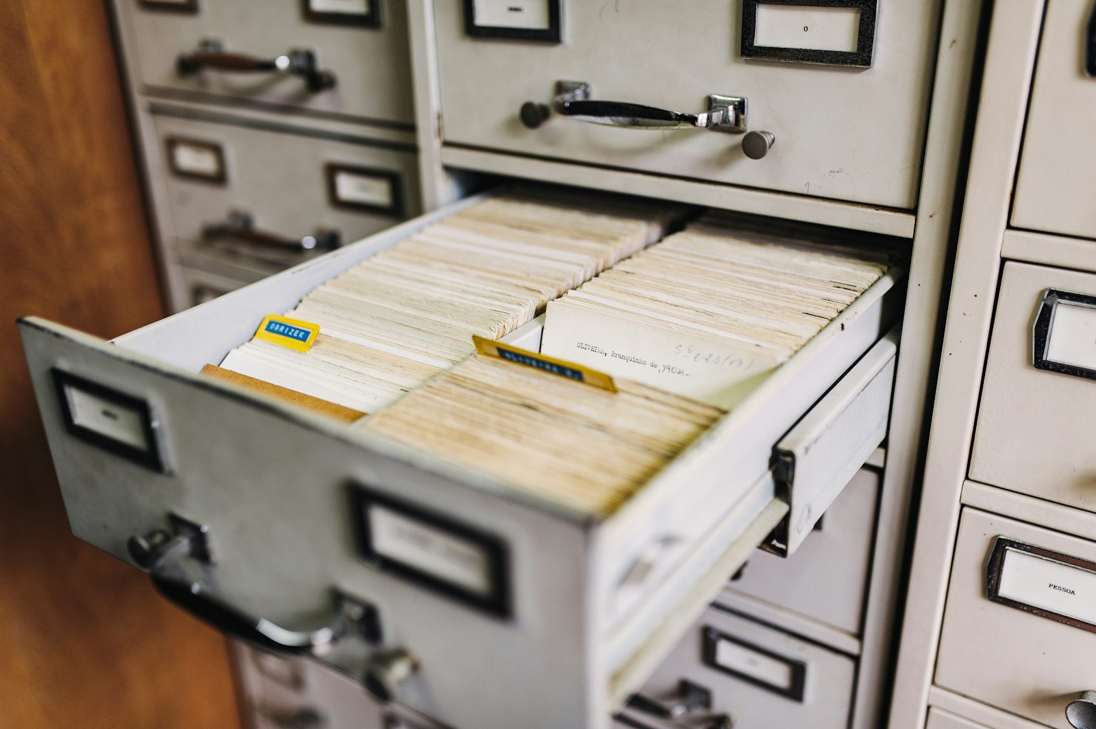 Filing cabinet representing records organized before closing the books